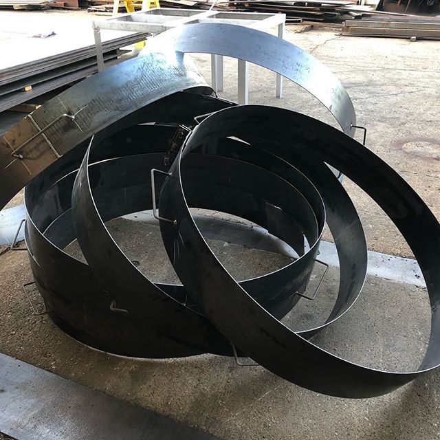 Millennium Fabrication worker with completed metal fabrication piece